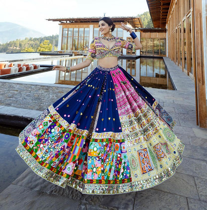 The only way to describe your Navratri night classy is by wearing this Blue Color Lehenga With Real Mirror Work  KNK-1473