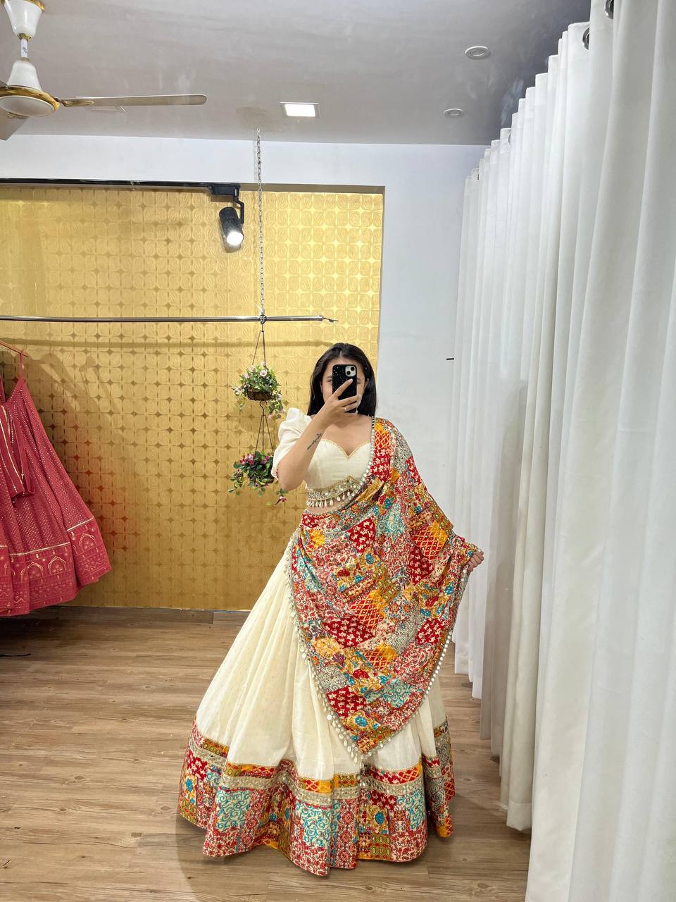 White lehenga and choli ensemble, adorned with a matching dupatta